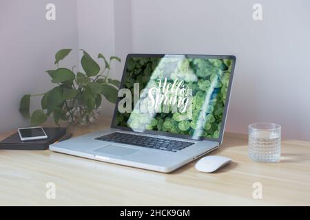 workplace in the corner, computer, mouse, water on the table Stock Photo