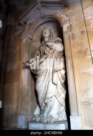 Statue of Virgin Mary in the niche on the left side of the entrance gallery, of the Estrela Basilica, 18th-century monument of late baroque, Lisbon Stock Photo