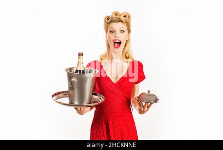 Pinup restaurant waiter with champagne and service tray. Serving presentation concept. Stock Photo