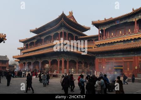 People praying at The Lama Temple Stock Photo