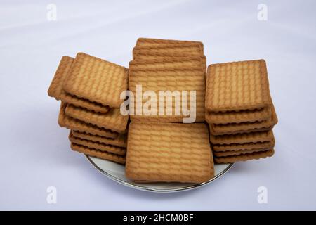 Brown color Wheat biscuits in the Plate isolated on Background Stock Photo