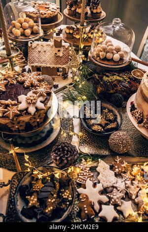 Assorted Christmas holiday desserts and sweets on the festive table Stock Photo