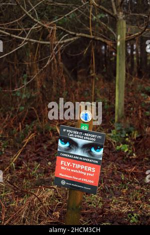 Fly-tipping warning sign in the UK countryside. Stock Photo