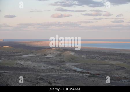 Mujnak, Uzbekistan. 21st Oct, 2021. The water in the western part of the Aral Sea stands calmly in the evening sun. Every year, according to estimates, the water retreats further by about 500 meters due to lack of inflows. The Aralkum salt and sand desert is growing. The region is considered the greatest ecological disaster on earth. (to the KORR report 'Eco-disaster Aral Sea: The fight for its remains continues') Credit: Ulf Mauder/dpa/Alamy Live News Stock Photo