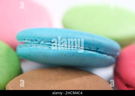 Close up of macaroon on blue background with copy space  Stock Photo