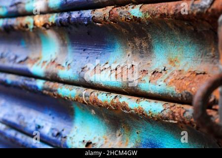 Closeup shot of a rusty old surface of a shutter as a background Stock Photo