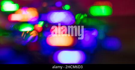 Abstract blurred dark background with colored lights. Stock Photo