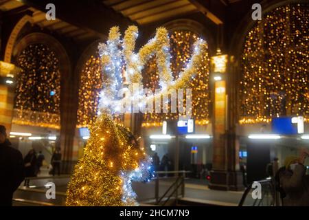 Features and architecture of Amsterdam Central Station in the evening Stock Photo