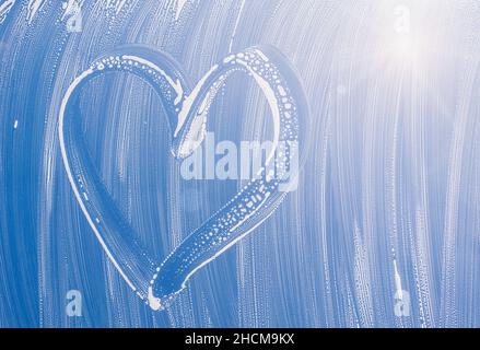 heart on window during cleaning the window Stock Photo
