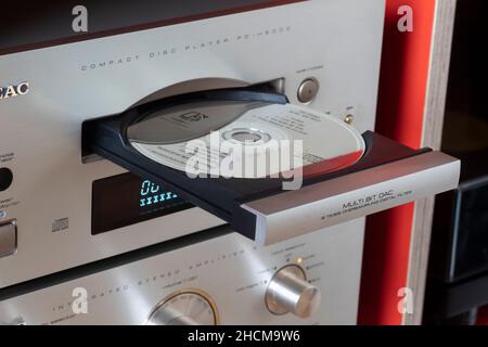 A CD in an open CD player Stock Photo