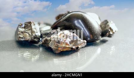 Shungit is a black rock that consists mainly of carbon and was photographed in top quality and studio quality. Stock Photo