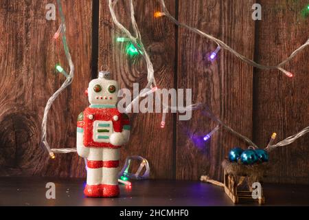 Christmas robot with blue spheres, lights and sleigh Stock Photo