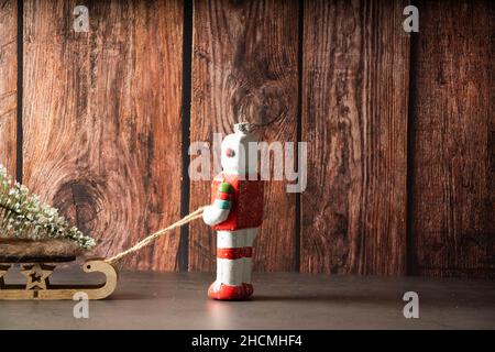 Christmas robot pulling a sled from behind Stock Photo