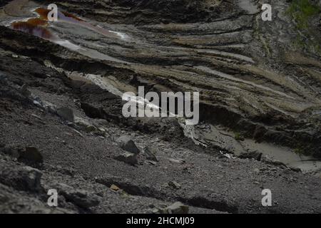 Photo of a rock on asphalt ground Stock Photo