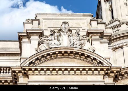 Detail of allegorical sculptures by Alfred Drury representing horror and dignity of war on the facade of the Old War Office Building, Whitehall, Londo Stock Photo