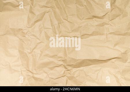 Brown creased paper background texture or backdrop Stock Photo