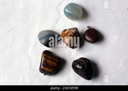 Semiprecious stones on a table with white background Stock Photo