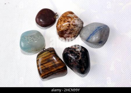 Semiprecious stones on a table with white background Stock Photo