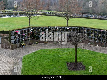 Berchem-Sainte-Agathe, Brussels Capital Region, Belgium - 12 26 2021: Urns and gravestones of the local cemetery Stock Photo