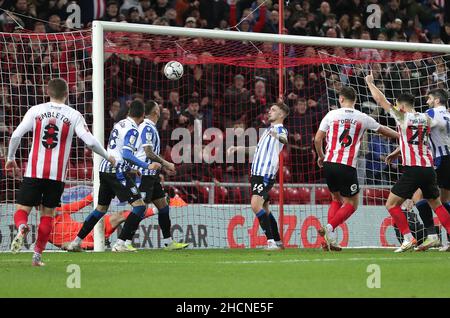 Sunderland's Callum Doyle (third right) scores their side's third goal of the game during the Sky Bet League One match at the Stadium of Light, Sunderland. Picture date: Thursday December 30, 2021. Stock Photo