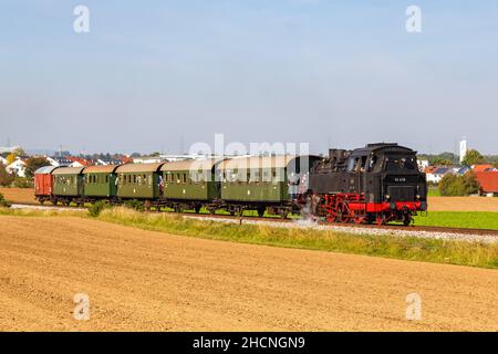 Korntal, Germany - October 10, 2021: Steam train locomotice railway engine of Strohgäubahn in Korntal, Germany. Stock Photo