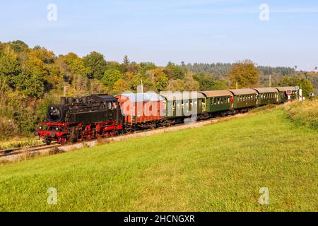 Weissach, Germany - October 10, 2021: Steam train locomotice railway engine of Strohgäubahn in Weissach, Germany. Stock Photo