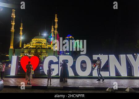 GROZNY, RUSSIA - JUNE 24, 2018: Akhmad Kadyrov Mosque officially known as The Heart of Chechnya behind the letters I Love Grozny in Grozny, Russia. Stock Photo