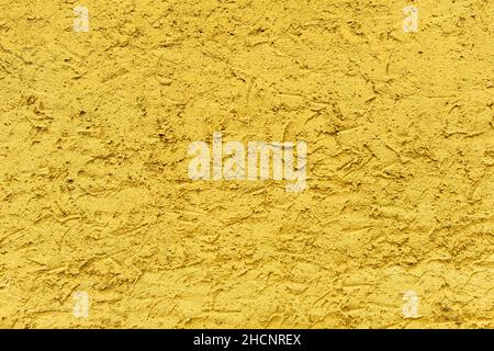 Rough version of Yellow plaster. Textured wall background Stock Photo