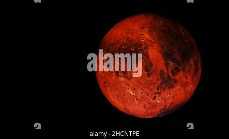 Abstract round red planet rotating on black background, seamless loop. Day and night on red Mars planet, light and shadow, spinning colorful sphere in Stock Photo