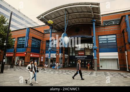 Slough, UK. 10th July, 2021. Shoppers pass the Observatory shopping centre. Plans are shortly expected to be submitted to Slough Borough Council to re Stock Photo