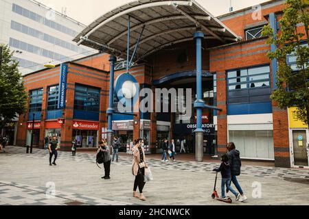 Slough, UK. 10th July, 2021. Shoppers pass the Observatory shopping centre. Plans are shortly expected to be submitted to Slough Borough Council to re Stock Photo