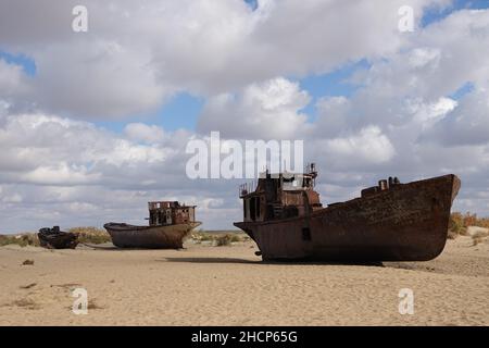 Mujnak, Uzbekistan. 21st Oct, 2021. Rusty ships lie in the sand of the former port city, from which the water retreated decades ago. The salt and sand desert of Aralkum continues to grow. The region is considered the biggest ecological disaster on earth. (to the KORR report 'Eco-disaster Aral Sea: The fight for its remains continues') Credit: Ulf Mauder/dpa/Alamy Live News Stock Photo
