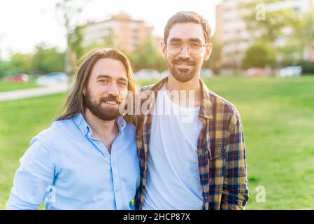A happy gay couple looking at camera spending time together Stock Photo