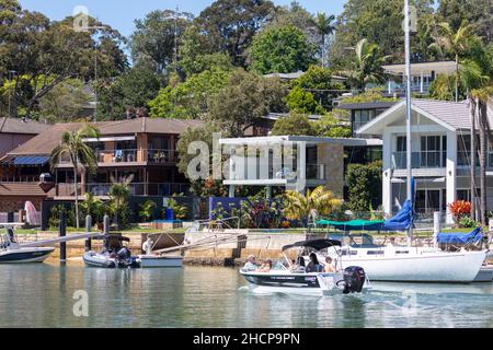 Expensive waterfront Sydney homes with private jetty and wharfs with boats and yachts in the Sydney suburb of Newport on Pittwater,Australia Stock Photo