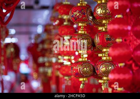 Chinese New Year 2022 red lanterns and decorations at a local market for the tiger year. Stock Photo