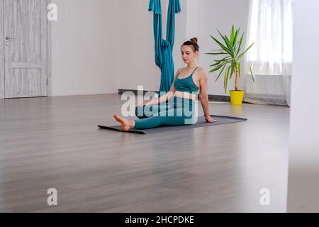 Portret of Young sporty attractive woman practicing yoga, working out Stock Photo