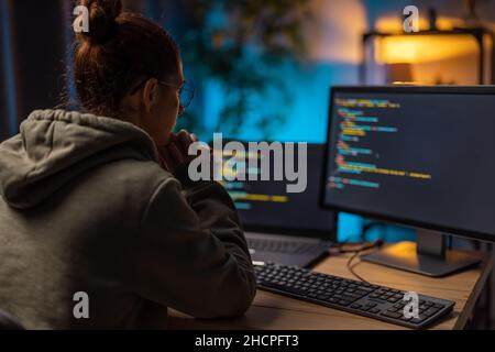 Woman coding at home Stock Photo