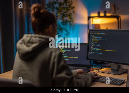 Woman using computers for programming Stock Photo