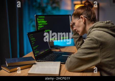 Woman programming at home Stock Photo