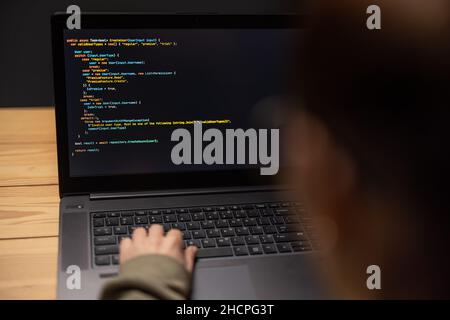 Woman using laptop for data code Stock Photo