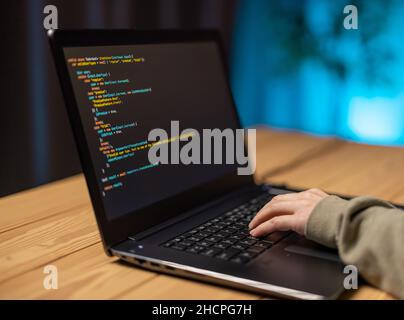 Woman coding on laptop Stock Photo