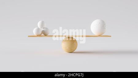 wooden scale balancing one big ball and four small ones. Concept of harmony and balance Stock Photo