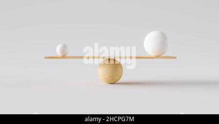 wooden scale balancing one big ball and one small ball. Concept of harmony and balance Stock Photo