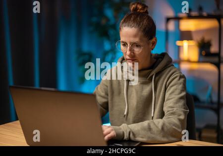 Woman using laptop for work Stock Photo