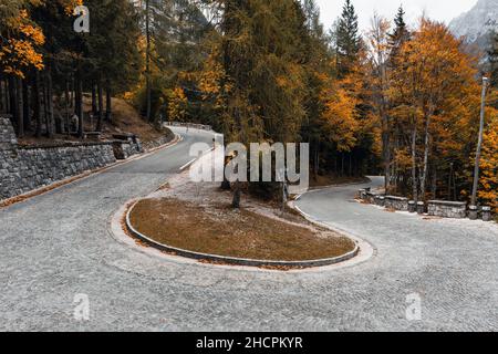 Hairpin turn on Vrsic mountain pass road in autumn in the Julian Alps, Slovenia Stock Photo