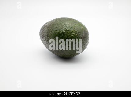 Fresh Avocado fruit on a white background, NOT cut out. Stock Photo