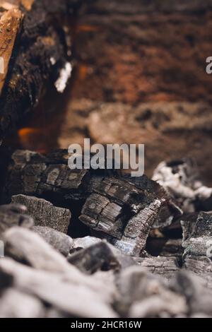 Smoldering embers and ashes in a bonfire. Close up. Stock Photo