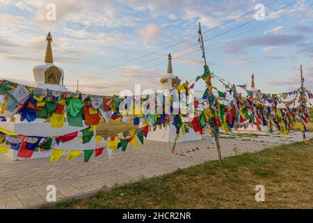 Stupas and flags near Syakusn Syume, Geden Sheddup Choikorling Monastery, Tibetan Buddhist monastery in Elista, Republic of Kalmykia, Russia Stock Photo