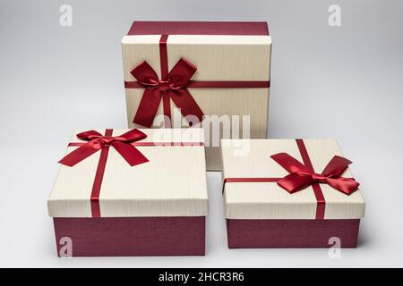 three red and white gift boxes. christmas, valentine.birthday Stock Photo