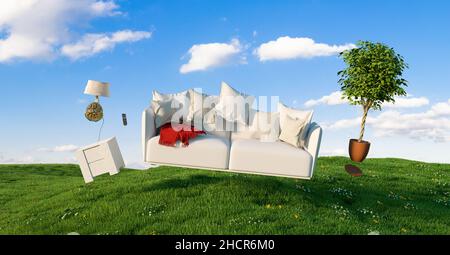 Zero Gravity Sofa hovering over a meadow with furniture and blue sky Stock Photo